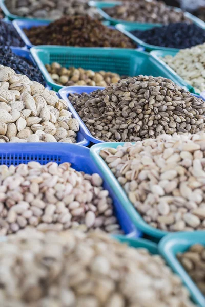 Osh bazaar in Kyrgyzstan - nuts and raisins for sale. — Stock Photo, Image