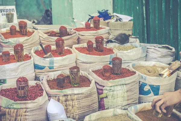 Vivid oriental central asian market with bags full of various sp — Stock Photo, Image