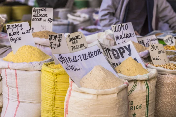 Vivid oriental central asian market with bags full of various sp — Stock Photo, Image