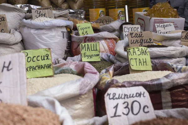 Spices and vegetables in bags at local bazaar in Osh. Kyrgyzstan