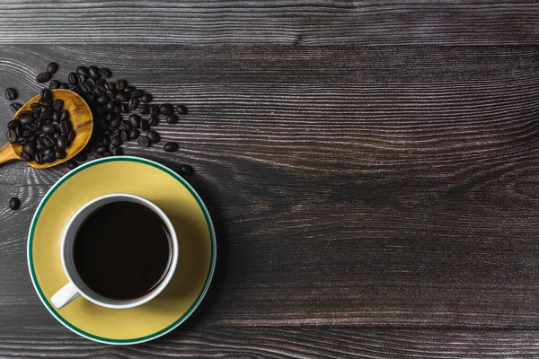 Black Coffee White Cup Yellow Saucer Wooden Backdrop —  Fotos de Stock