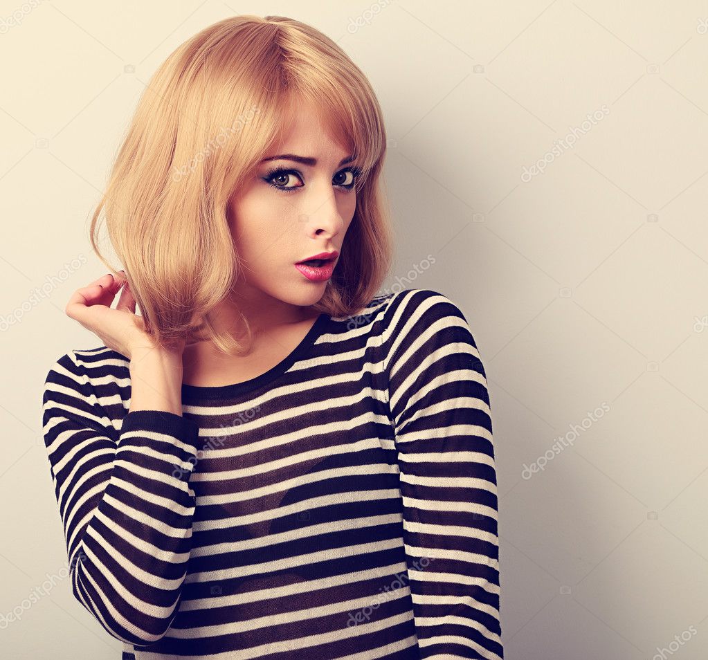 Unhappy Blond Woman With Short Hairstyle Surprising From Bad New