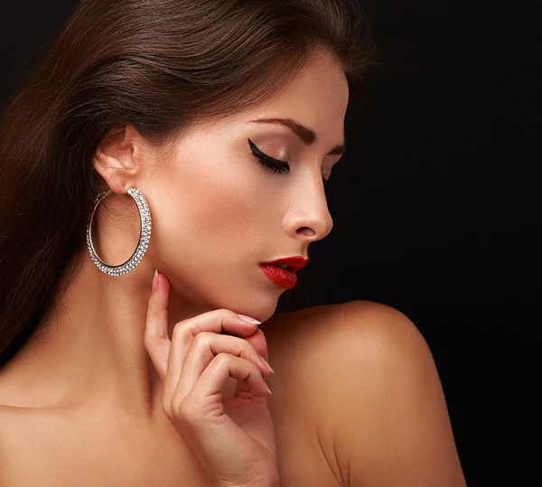 Beautiful sexy woman face profile with closed eyeliner eyes. Closeup portrait