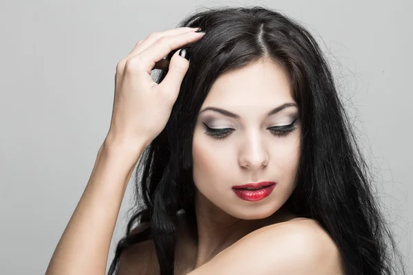 Beautiful woman with curly hair. Stock Picture