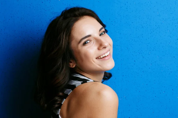 Portrait attractive woman   on blue background. — Stock Photo, Image