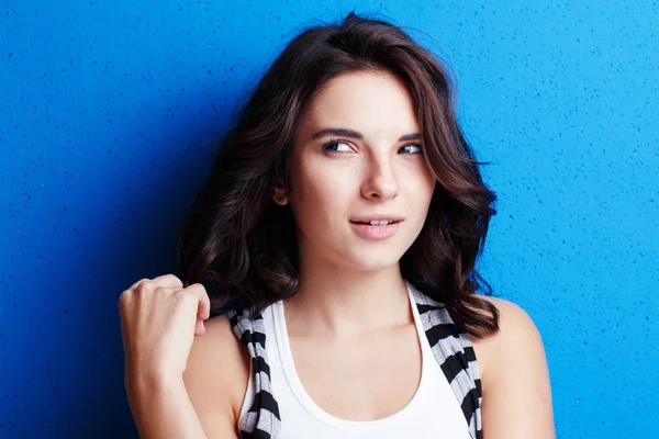 Portrait attractive woman   on blue background. — Stock Photo, Image