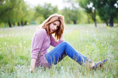 A beautiful girl enjoys nature.