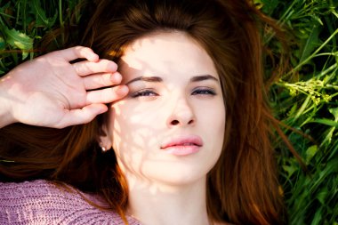A beautiful girl enjoys nature.