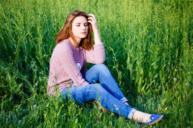 A beautiful girl enjoys nature.