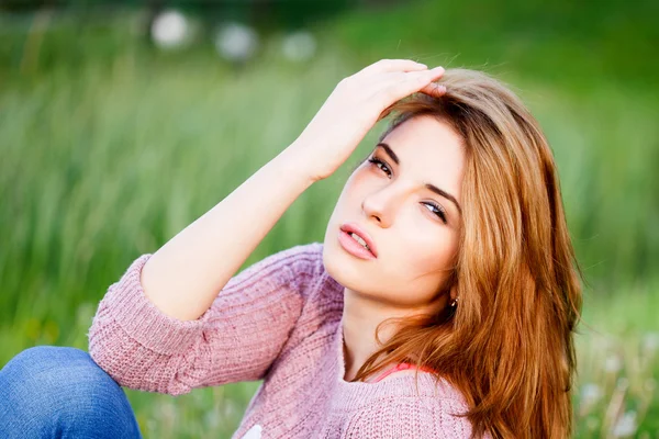 A beautiful girl enjoys nature.