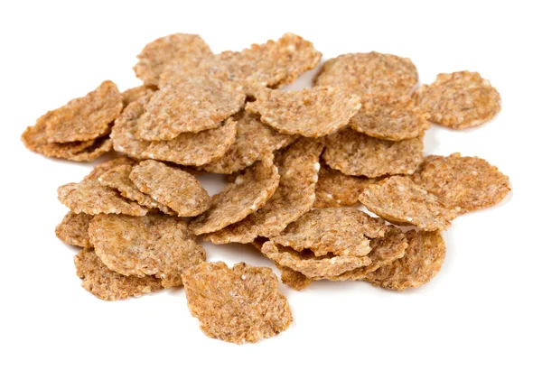 Pile of bran flakes isolated on white — Stock Photo, Image