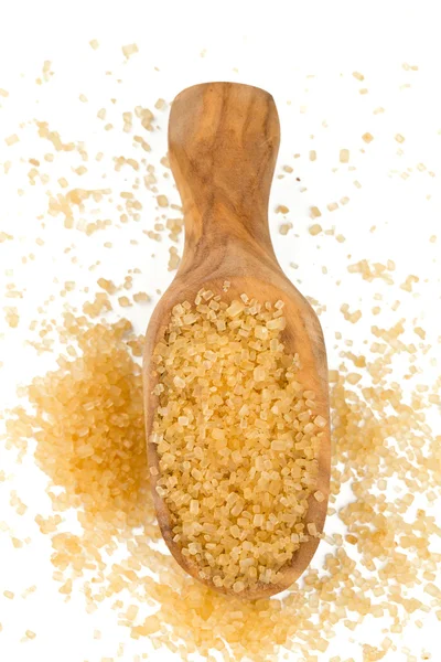 Wooden scoop wth brown sugar — Stock Photo, Image