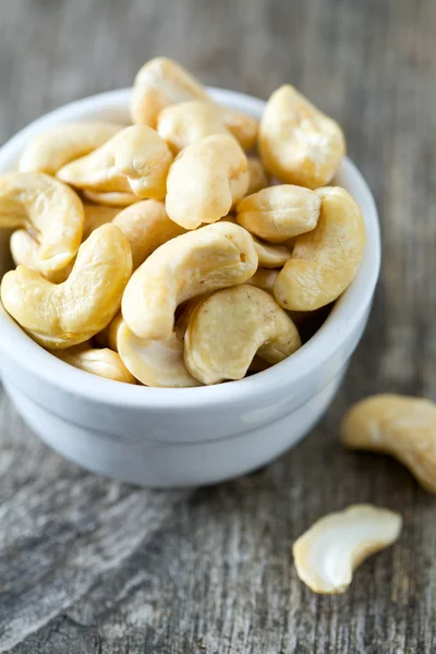 Cashew nuts on wooden surface — Stock Photo, Image