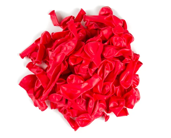 Деформовані червоні повітряні кулі ізольовані на білому — стокове фото