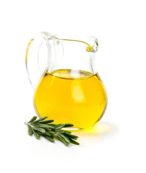 Olive oil in a glass patcher and twig of rosemary — Stock Photo, Image