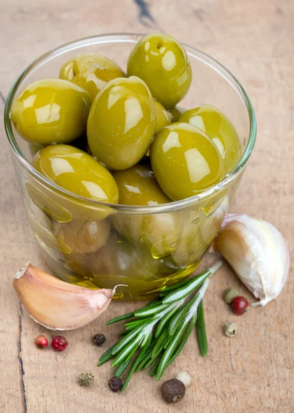 Green olives in a glass bowl — Stock Photo, Image