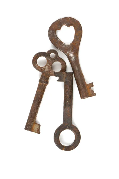 3 Rustic keys isolated on white — стоковое фото