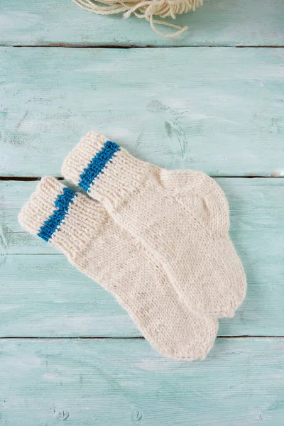 White Knitted Socks Turquoise Wooden Surface — Stock Photo, Image