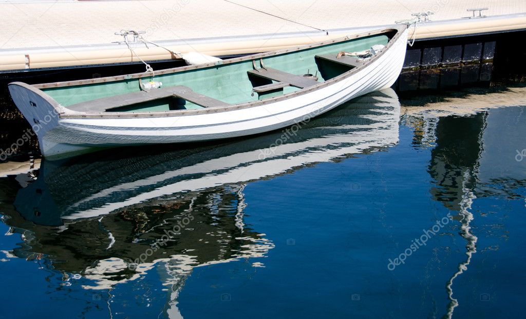 White rowboat parked in Victoria Bay, British Columbia