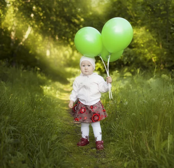 Menina com balões verdes — Fotografia de Stock