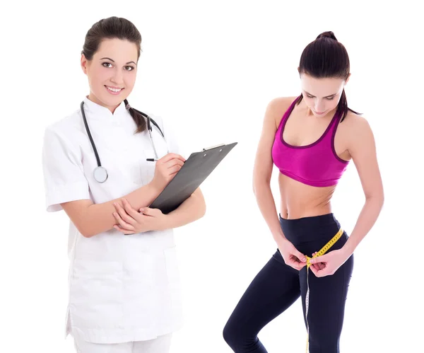 Jovem médica ou nutricionista com mulher magro no sportswear eu — Fotografia de Stock