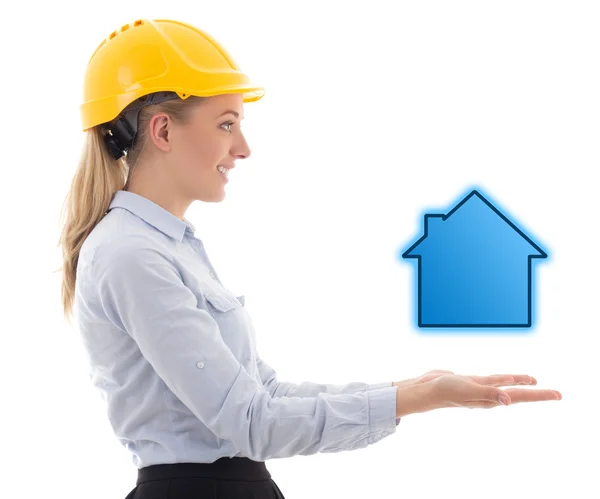 Side view of business woman in builder helmet holding small hous — Stock Photo, Image