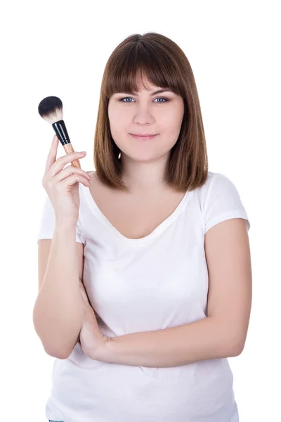 Jovem mulher bonita com maquiagem pincel isolado no branco — Fotografia de Stock