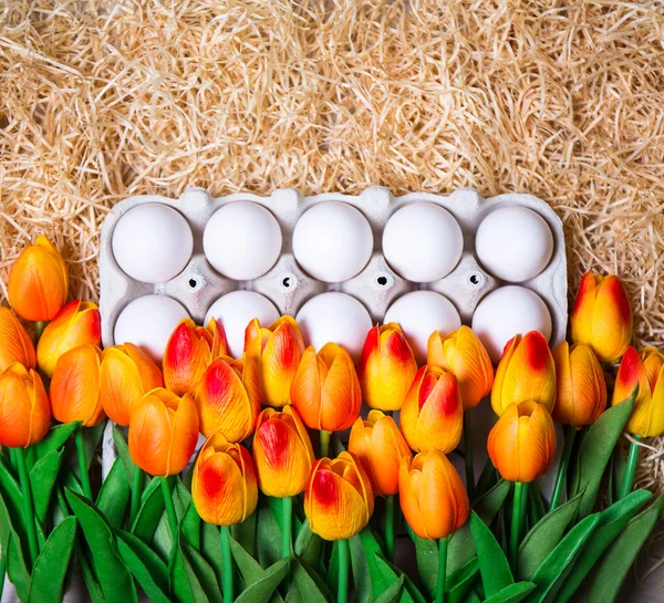 Easter background - close up of box with eggs and orange flowers — Stock Photo, Image