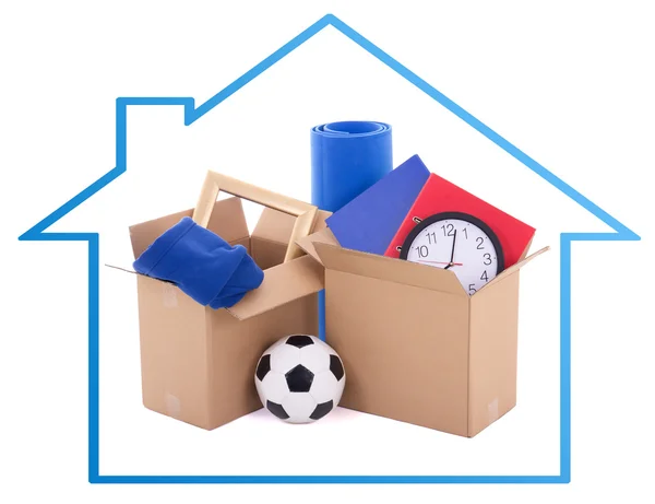 Moving day concept - cardboard boxes with stuff isolated on whit — Stock Photo, Image