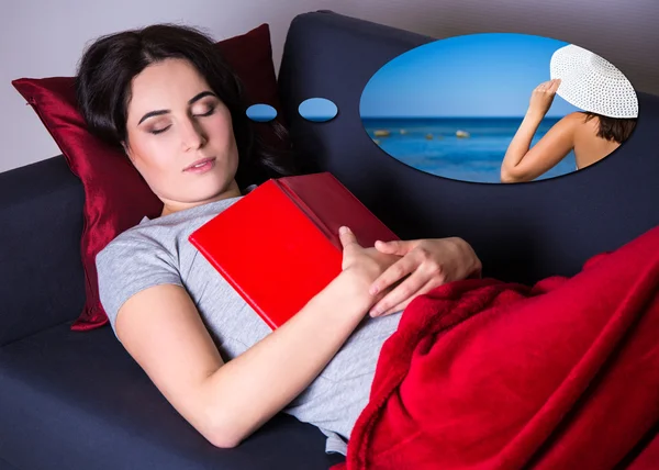 Woman sleeping with book on sofa at home and dreaming about trav — Stock Photo, Image