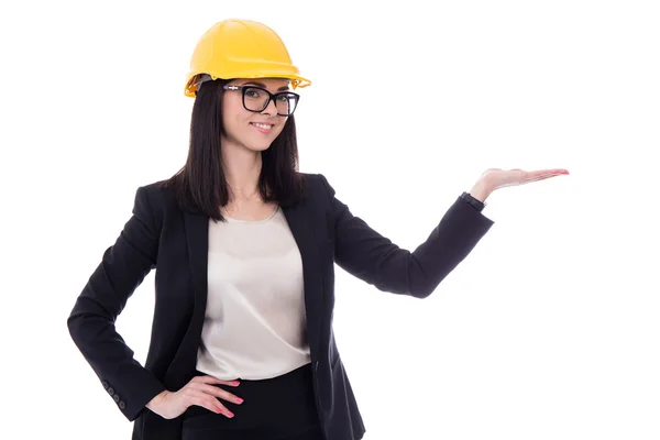 Business woman architect in yellow helmet holding or presenting — Stock Photo, Image