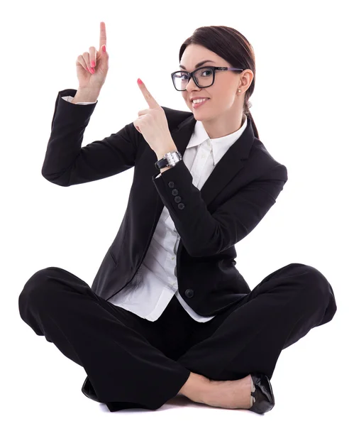 Young beautiful happy business woman sitting and pointing at som — Stock Photo, Image