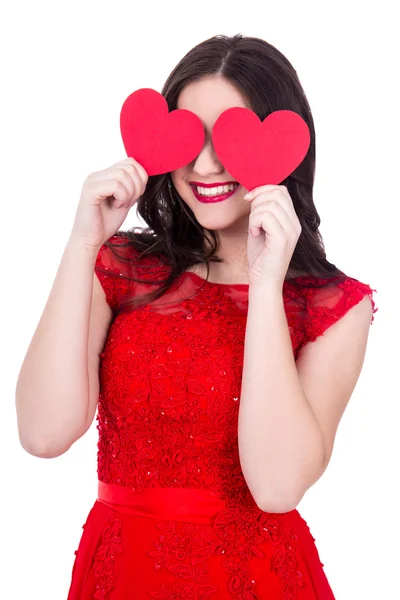 Portrait of happy woman in red dress covering eyes with two pape — Stock Photo, Image