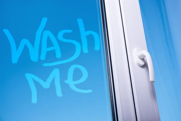 Wash me words on dirty window — Stock Photo, Image