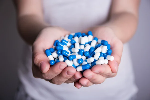 Close up of pills in female hands — Stock Photo, Image