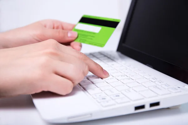 Online shopping - laptop and hands holding credit card Stock Photo