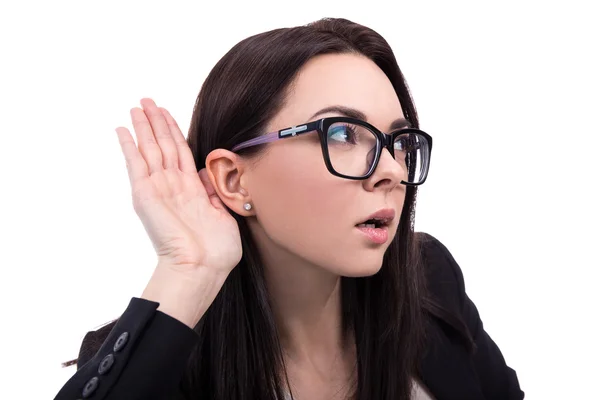 Young business woman overhears a conversation isolated on white — Stock Photo, Image