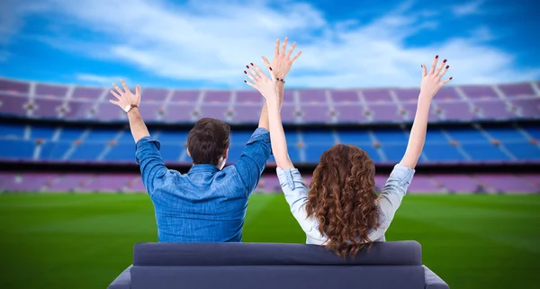 Young couple of soccer fans supporting their team or celebrating — Stock Photo, Image