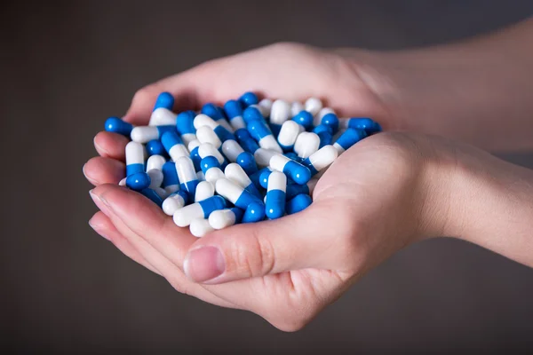 Close up of tablets in female hands — Stock Photo, Image