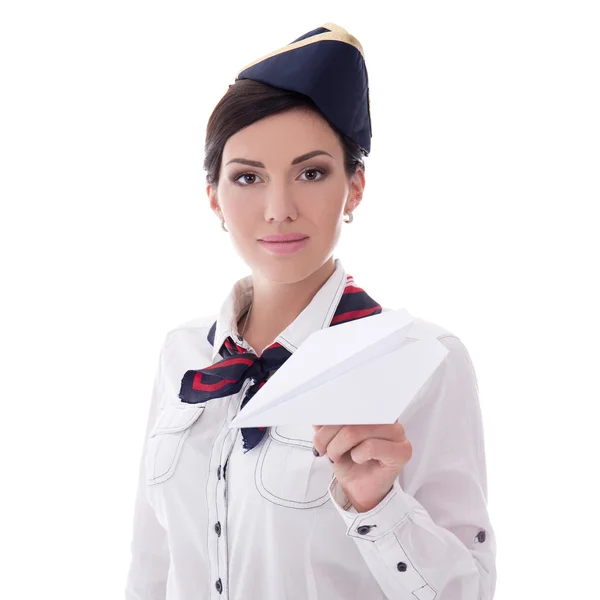 Jonge stewardess holding papier vliegtuig geïsoleerd op wit — Stockfoto