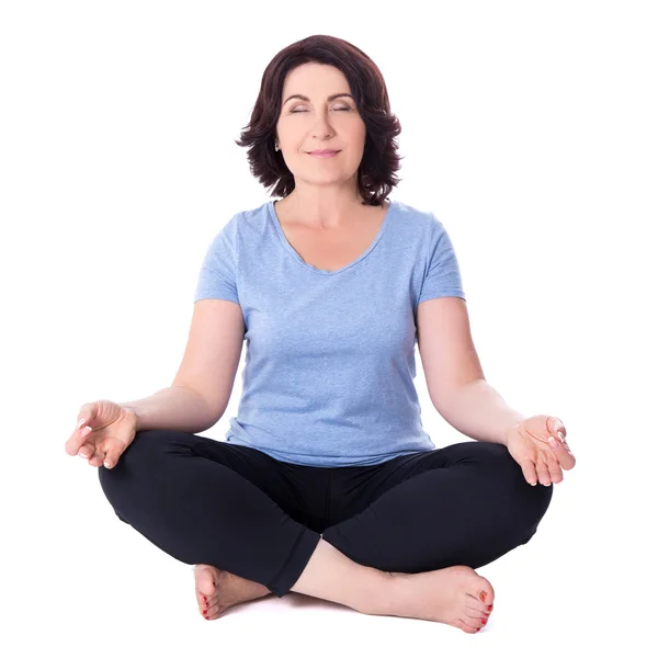 Mature woman sitting in yoga pose isolated on white — Stock Photo, Image