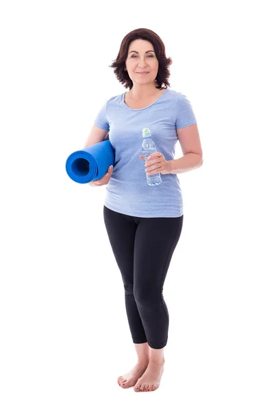 Full length portrait of mature woman in sportswear with yoga mat — Stock Photo, Image