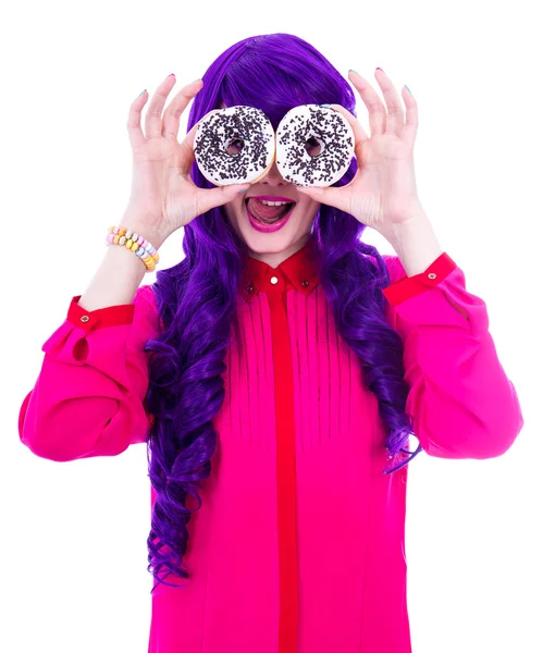 Surprised woman with purple hair covering her eyes with donuts i — Stock Photo, Image