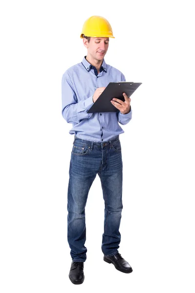 Middle aged handsome business man in yellow builder's helmet wri — Stock Photo, Image