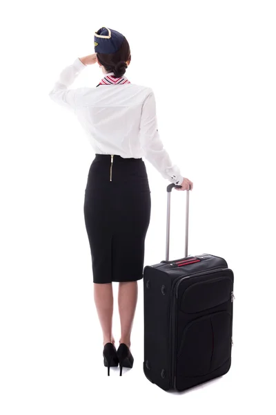 Arkadan görünüşü üzerinde beyaz izole bavul ile ayakta hostes — Stok fotoğraf