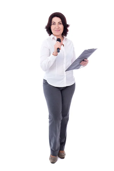 Full length portrait of mature female reporter with microphone a — Stock Photo, Image