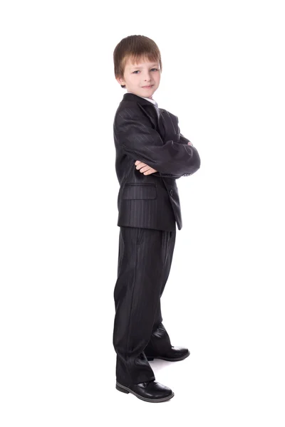 Маленький мальчик в деловой костюм, изолированные на белом — стоковое фото