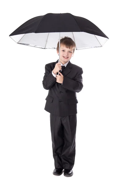 Cute little boy in business suit with umbrella isolated on white — Stock Photo, Image