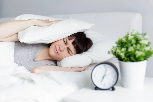 Routine Concept Young Woman Waking Alarm Clock Covering Head Pillow — Stock Photo, Image