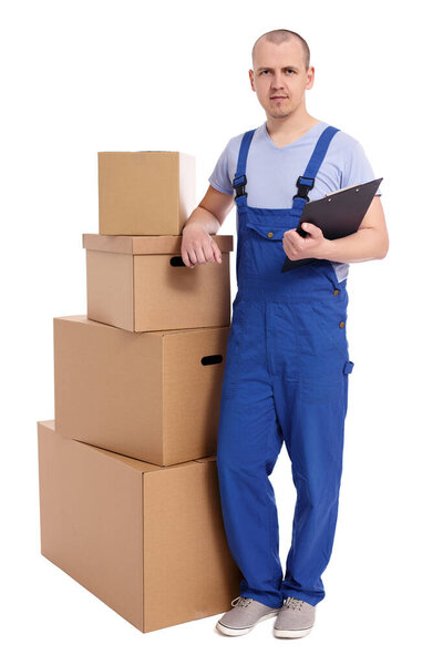 full length portrait of loader man with heap of boxes and clipboard isolated on white background
